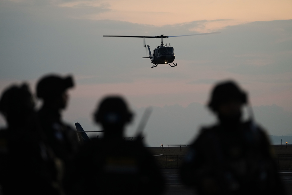 A police helicopter lands at an Air Force base carrying a shipment of drugs seized at a Guatemalan Pacific port, in Guatemala City, Monday, Jan. 26, 2026. (AP Photo/Moises Castillo)