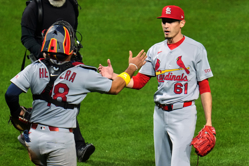 St. Louis Cardinals pitcher Riley O'Brien (61) celebrates with catcher Iván Herrera after getting the final out of a baseball game against the Pittsburgh Pirates in Pittsburgh, Wednesday, April 29, 2026. (AP Photo/Gene J. Puskar)