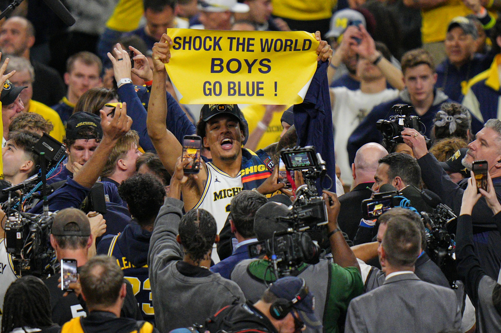 Michigan's Yaxel Lendeborg celebrates after defeating UConn in the NCAA college basketball tournament national championship game at the Final Four, Monday, April 6, 2026, in Indianapolis. (AP Photo/AJ Mast)