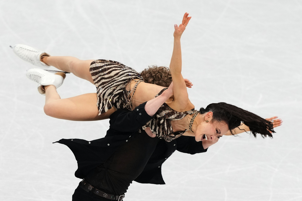 Madison Chock and Evan Bates of the United States compete during the rhythm dance in figure skating at the 2026 Winter Olympics, in Milan, Italy, Monday, Feb. 9, 2026. (AP Photo/Francisco Seco)