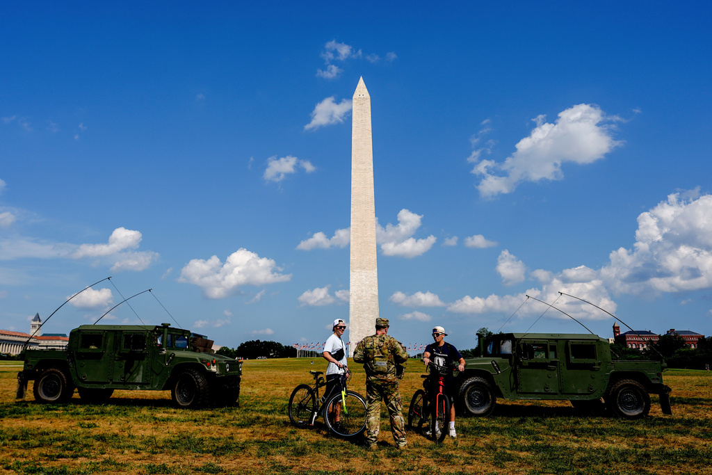Members of the District of Columbia National Guard patrol along the National Mall, Saturday, Aug. 16, 2025, in Washington. (AP Photo/Julia Demaree Nikhinson)