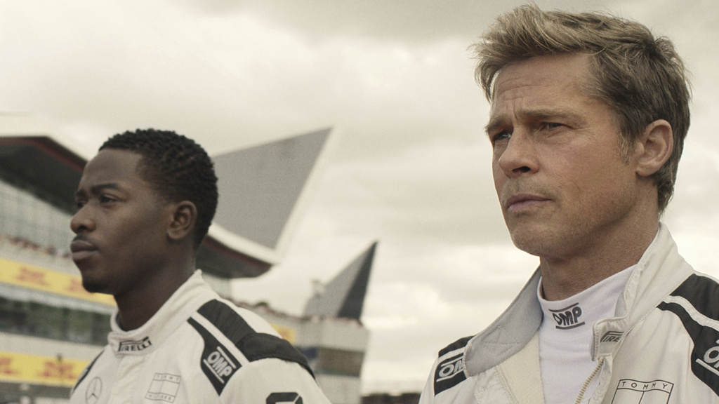 This image released by Apple TV+ shows Damson Idris as Joshua Pearce, left, and Brad Pitt as Sonny Hayes in a scene from &quot;F1 The Movie.&quot; (Apple TV+ via AP)