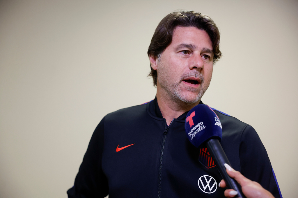United States' head coach Mauricio Pochettino talks with members of the media as he arrives with his teammates for the World Cup soccer tournament in Santa Ana, Calif., on Saturday, June 6, 2026. (AP Photo/Caroline Brehman)