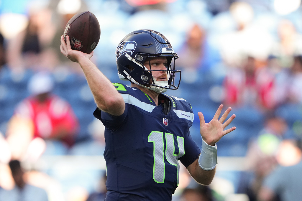 Seattle Seahawks quarterback Sam Darnold throws a pass during warmups before an NFL football game against the New England Patriots, Wednesday, Sept. 9, 2026, in Seattle. (AP Photo/Lindsey Wasson)