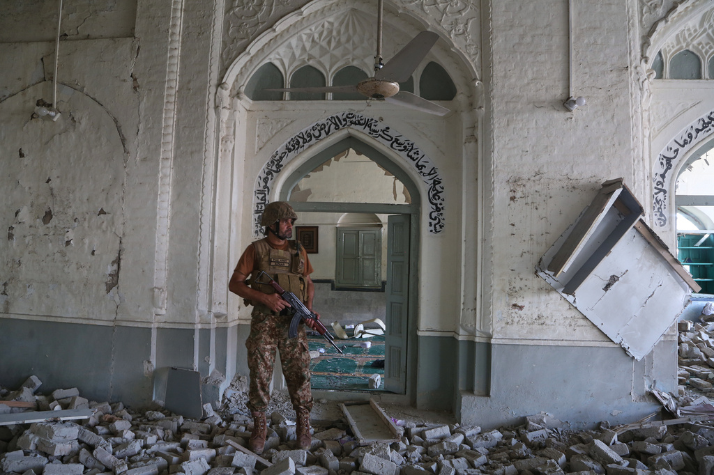 An Army soldier walks over rubble at the site of a bomb explosion at a mosque in Kohat, in northwestern Pakistan, Friday, Sept. 18, 2026. (AP Photo/Muhammad Sajjad)