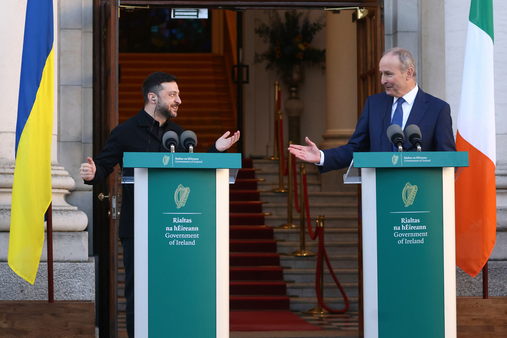 Ukraine's President Volodymyr Zelenskyy, left, and the Irish Taoiseach Micheal Martin gesture to each other during a joint conference in Dublin, Ireland, Tuesday, Dec. 2, 2025. (AP Photo/Peter Morrison)
