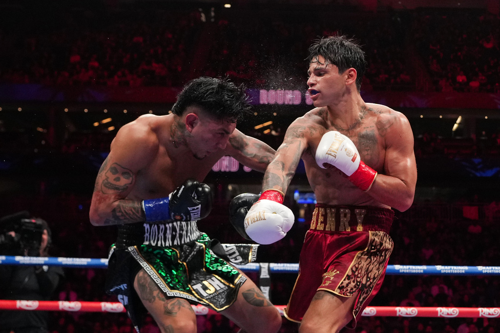Ryan Garcia, right, fights Mario Barrios in a WBC welterweight title boxing match Saturday, Feb. 21, 2026, in Las Vegas. (AP Photo/Lucas Peltier)