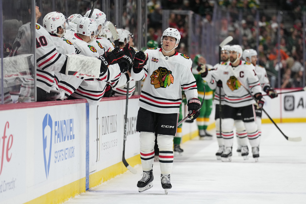 Chicago Blackhawks center Ryan Donato (8) celebrates after scoring a goal during the first period of an NHL hockey game against the Minnesota Wild, Tuesday, Jan. 27, 2026, in St. Paul, Minn. (AP Photo/Abbie Parr)
