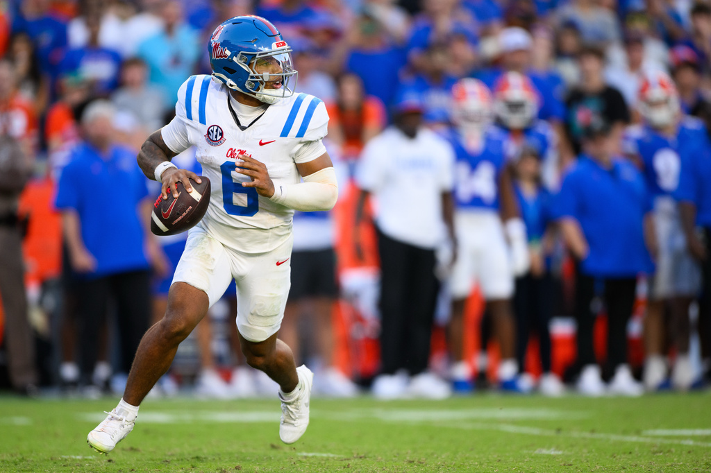 Mississippi quarterback Trinidad Chambliss (6) scrambles during the second half of an NCAA college football game against Florida, Saturday, Sept. 26, 2026, in Gainesville, Fla. (AP Photo/Noah Lantor)
