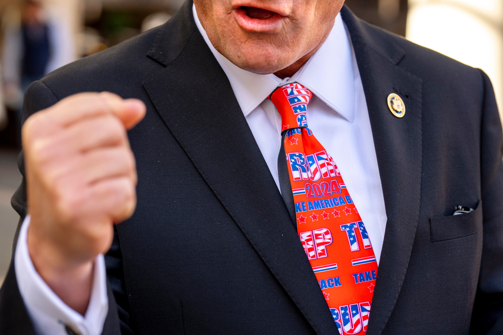 FILE - Rep. Troy Nehls, R-Texas, wears a Trump-themed tie as he speaks with a reporter after a meeting with President-elect Donald Trump, Nov. 13, 2024, at the Grand Hyatt Hotel in Washington. (AP Photo/Jacquelyn Martin, File)