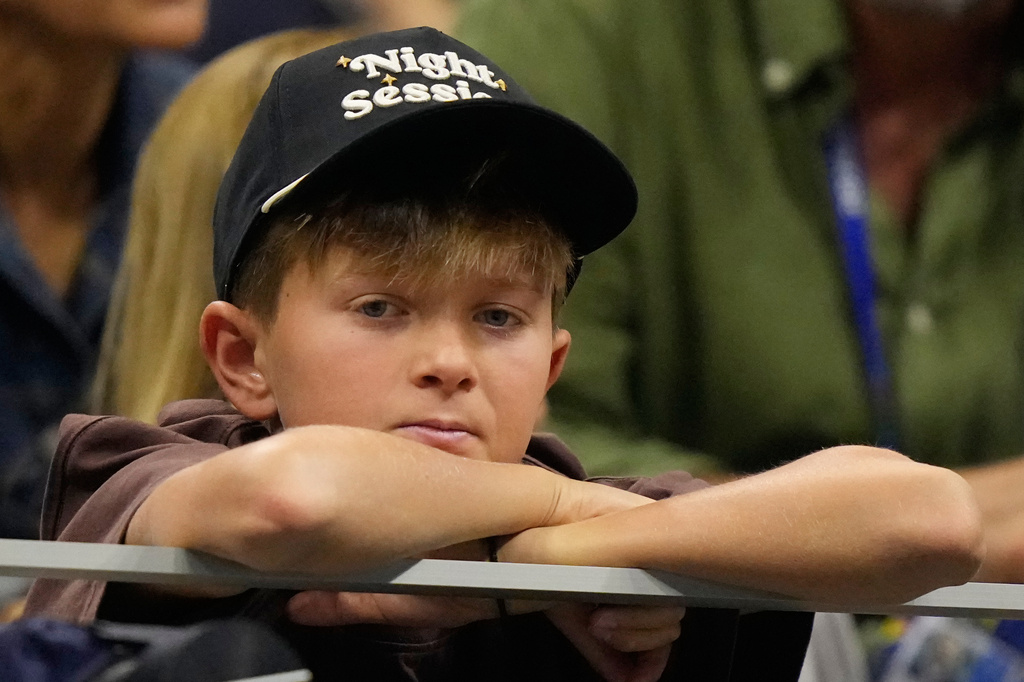 Stefan Djokovic watches his dad Novak Djokovic, of Serbia, compete against Mariano Navone, of Argentina, during the first round of the U.S. Open tennis championships Sunday, Aug. 30, 2026, in New York. (AP Photo/Frank Franklin II)