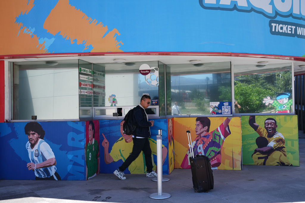 A man walks past the Football Museum in Pachuca, Hidalgo state, Mexico, Thursday, May 14, 2026. (AP Photo/Marco Ugarte)