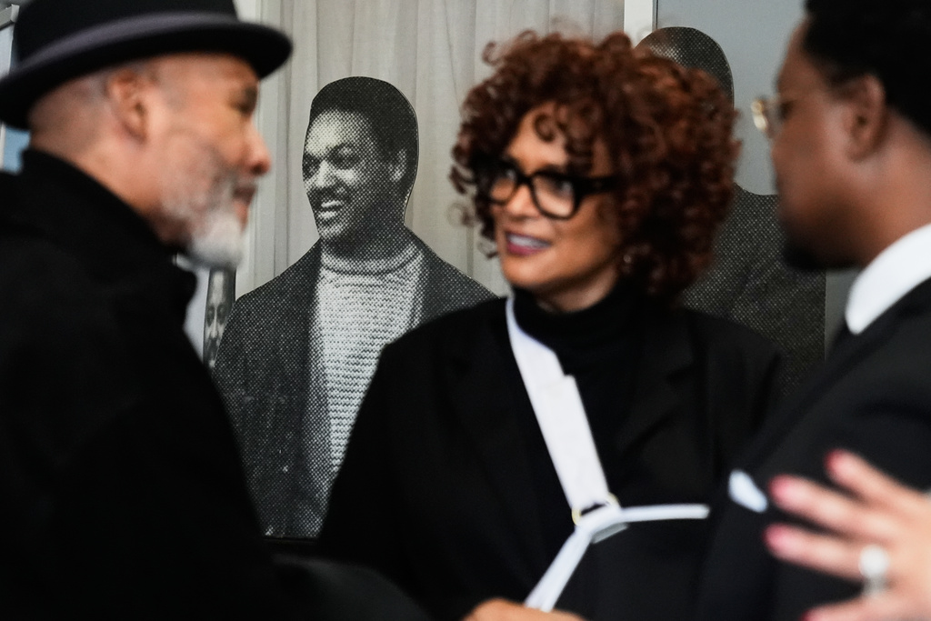 A cutout of Rev. Jesse Jackson is seen through the crowd during a public visitation for him at Rainbow PUSH Coalition headquarters Friday, Feb. 27, 2026, in Chicago. (AP Photo/Erin Hooley)