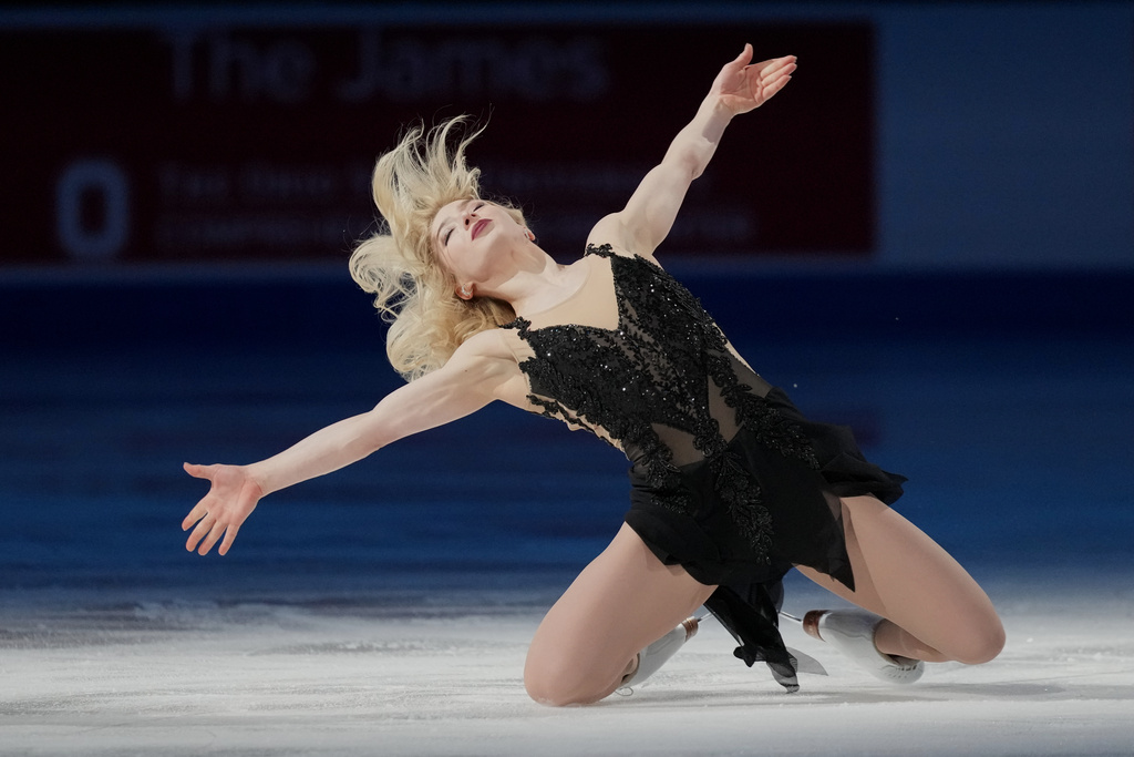 Amber Glenn skates during the "Making Team USA" performance at the U.S. Figure Skating Championships, Sunday, Jan. 11, 2026, in St. Louis. (AP Photo/Stephanie Scarbrough)