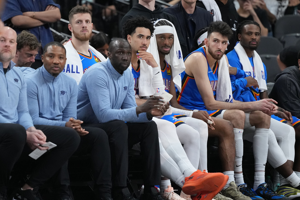 Oklahoma City Thunder players sit on the bench during the final minutes of Game 4 in the Western Conference finals NBA basketball playoffs series against the San Antonio Spurs in San Antonio, Sunday, May 24, 2026. (AP Photo/Eric Gay)