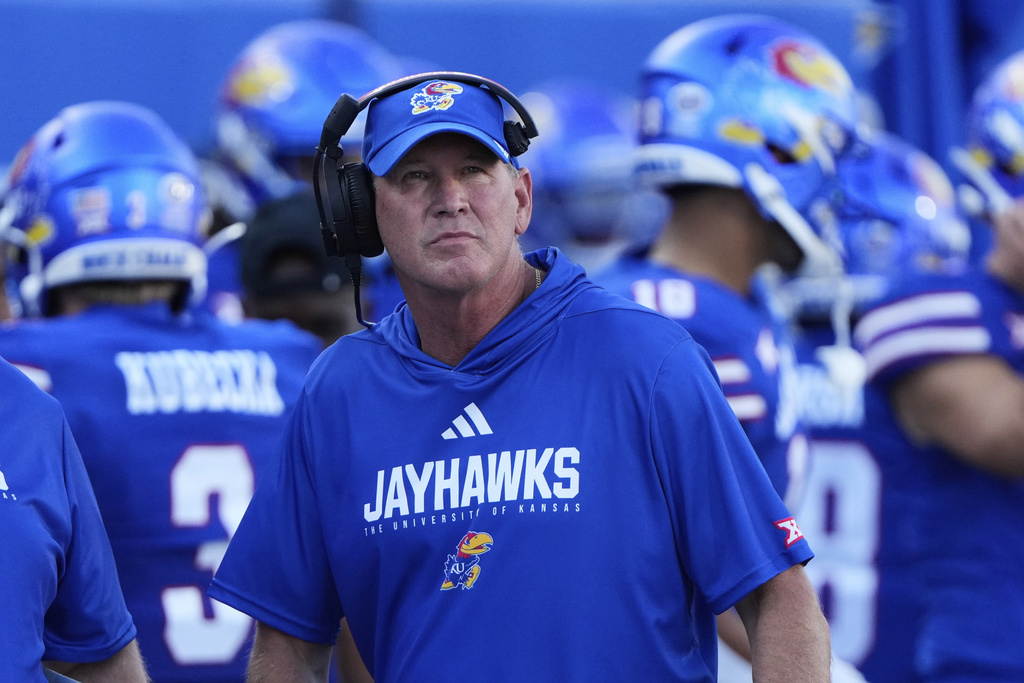 Kansas head coach Lance Leipold looks on during the first half of an NCAA college football game against Fresno State, Saturday, Aug. 23, 2025, in Lawrence, Kan. (AP Photo/Charlie Riedel)