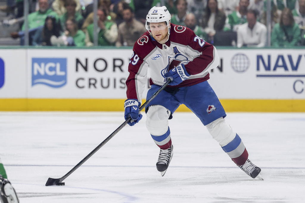 FILE - Colorado Avalanche center Nathan MacKinnon controls the puck during the second period of Game 5 of a first-round NHL hockey playoff series against the Dallas Stars in Dallas, April 28, 2025. (AP Photo/Gareth Patterson, File)