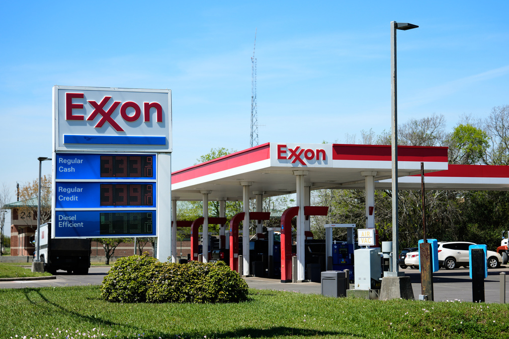 Prices are displayed on an Exxon gas station sign in Houston, Tuesday, March 17, 2026. (AP Photo/Ashley Landis)