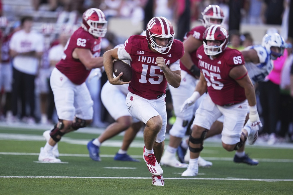 Indiana quarterback Fernando Mendoza (15) runs during the first half of an NCAA college football game against Indiana State, Friday, Sept. 12, 2025, in Bloomington, Ind. (AP Photo/Darron Cummings)