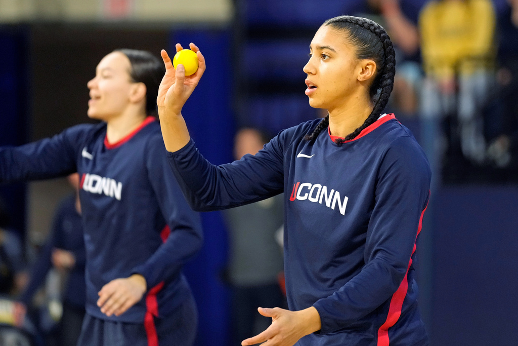 UConn guard Azzi Fudd warms up before an NCAA college basketball game against Marquette, Saturday, Feb. 14, 2026, in Milwaukee. (AP Photo/Kayla Wolf)