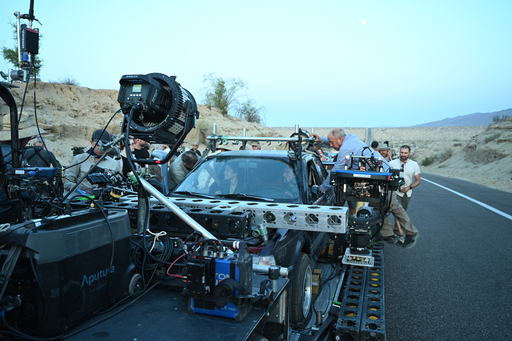 This image released by Warner Bros. Pictures shows Chase Infiniti and Leonardo DiCaprio in a scene from "One Battle After Another." (Michael Bauman/Warner Bros. Pictures via AP)Michael Bauman