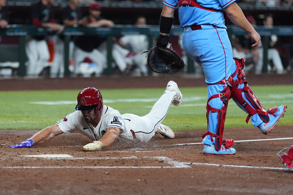 Arizona Diamondbacks' Ryan Waldschmidt scores a run against the St. Louis Cardinals during the fourth inning of a baseball game, Saturday, July 18, 2026, in Phoenix. (AP Photo/Ross D. Franklin)