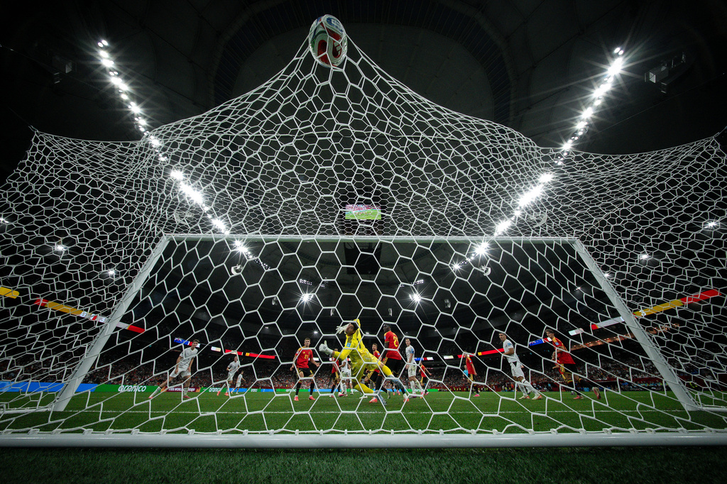 Belgium goalkeeper Thibaut Courtois (1) looks back at the ball after New Zealand's Elijah Just, not seen, scored a goal during the World Cup Group G soccer match between New Zealand and Belgium in Vancouver, British Columbia, Friday, June 26, 2026. (Ethan Cairns/The Canadian Press via AP)