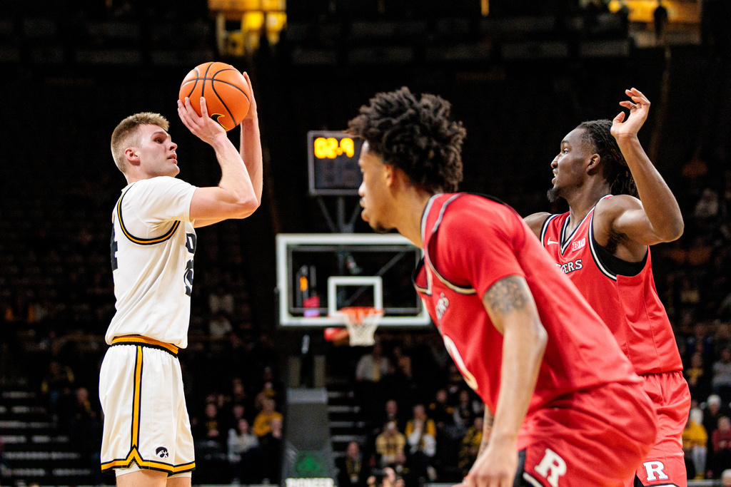 Iowa guard Bennett Stirtz (14) shoots the ball during an NCAA college basketball game between Iowa and Rutgers at Carver-Hawkeye Arena in Iowa City, Iowa on Tuesday, Jan. 20, 2026. (Nick Rohlman/The Gazette via AP)