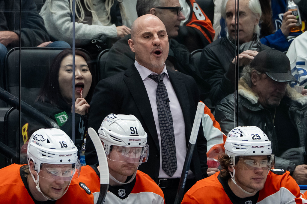 Philadelphia Flyers head coach Rick Tocchet yells during the third period of an NHL game against the Vancouver Canucks in Vancouver, on Tuesday, Dec. 30, 2025. (Ethan Cairns/The Canadian Press via AP)