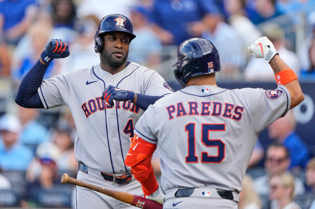 Houston Astros' Yordan Alvarez, left, celebrates with Isaac Paredes (15) after hitting a two-run home run during the first inning of a baseball game against the Kansas City Royals, Friday, June 12, 2026, in Kansas City, Mo. (AP Photo/Charlie Riedel)