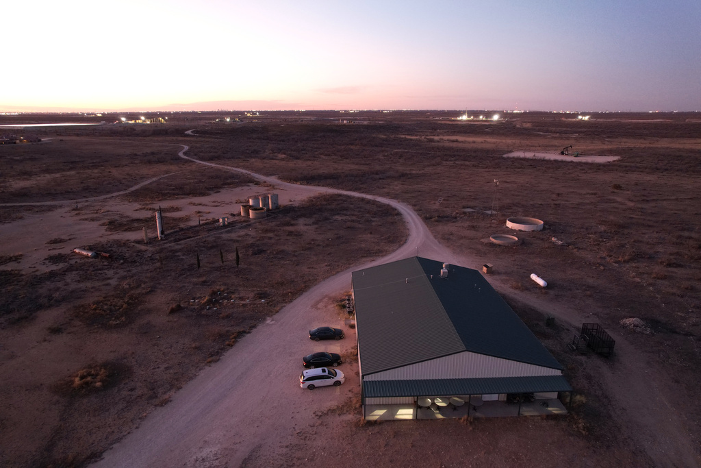 Lights shine inside the Mayflower Church hall, where members of the community gather for religious study or to enjoy downtime, in Midland, Texas, Jan. 19, 2025. (AP Photo/Rebecca Blackwell)