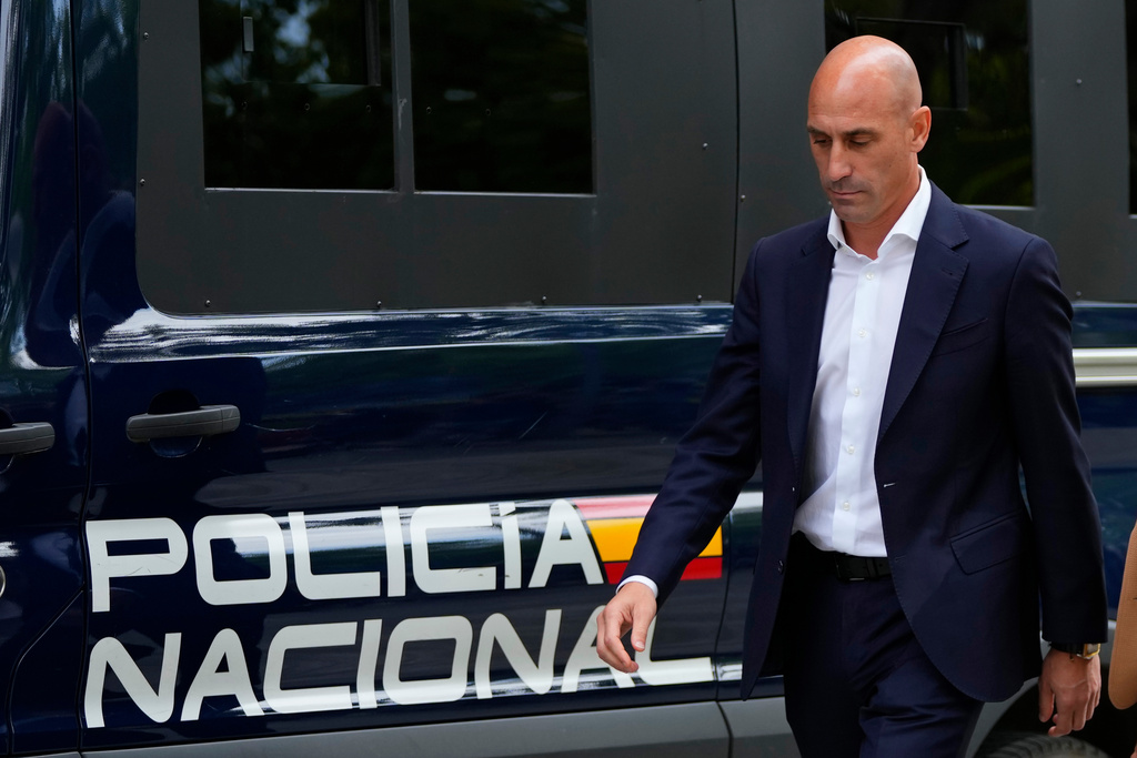 FILE - The former president of Spain's soccer federation Luis Rubiales passes a police van as he leaves after testifying at the National Court in Madrid, Spain,Sept. 15, 2023. (AP Photo/Manu Fernandez, File)