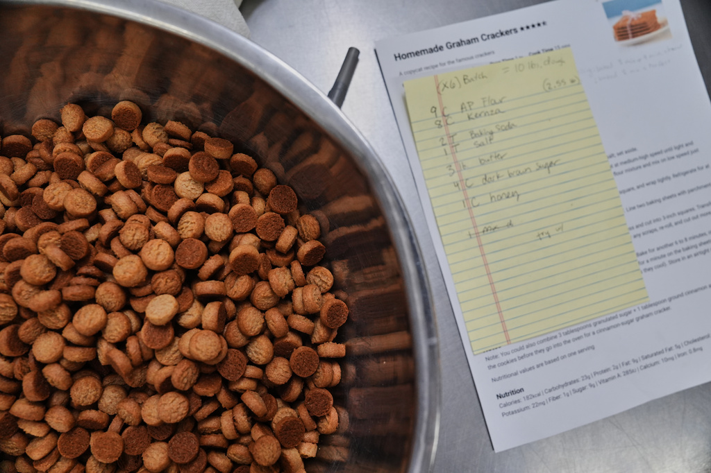 Small crackers made with Kernza flour sit in a bowl after baking in a test kitchen Tuesday, July 28, 2026, at Prairy in Newton, Kan. (AP Photo/Joshua A. Bickel)