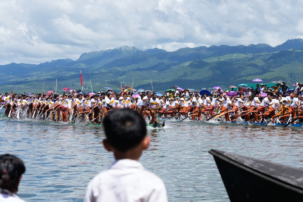 Intha ethnic people row their boats during a traditional boats racing competition to mark the Phaung Daw Oo pagoda festival Friday, Sept. 26, 2025, in Inle Lake, southern Shan State, Myanmar. (AP Photo/Thein Zaw)