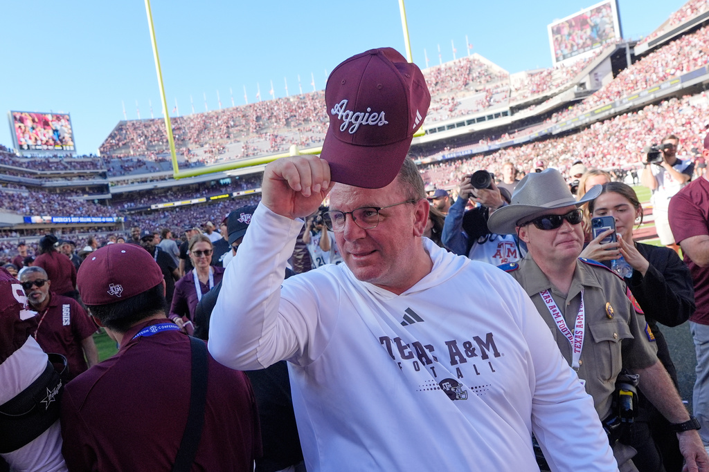 Texas A&M head coach Mike Elko celebrates after an NCAA college football game against South Carolina Saturday, Nov. 15, 2025, in College Station, Texas. (AP Photo/David J. Phillip)