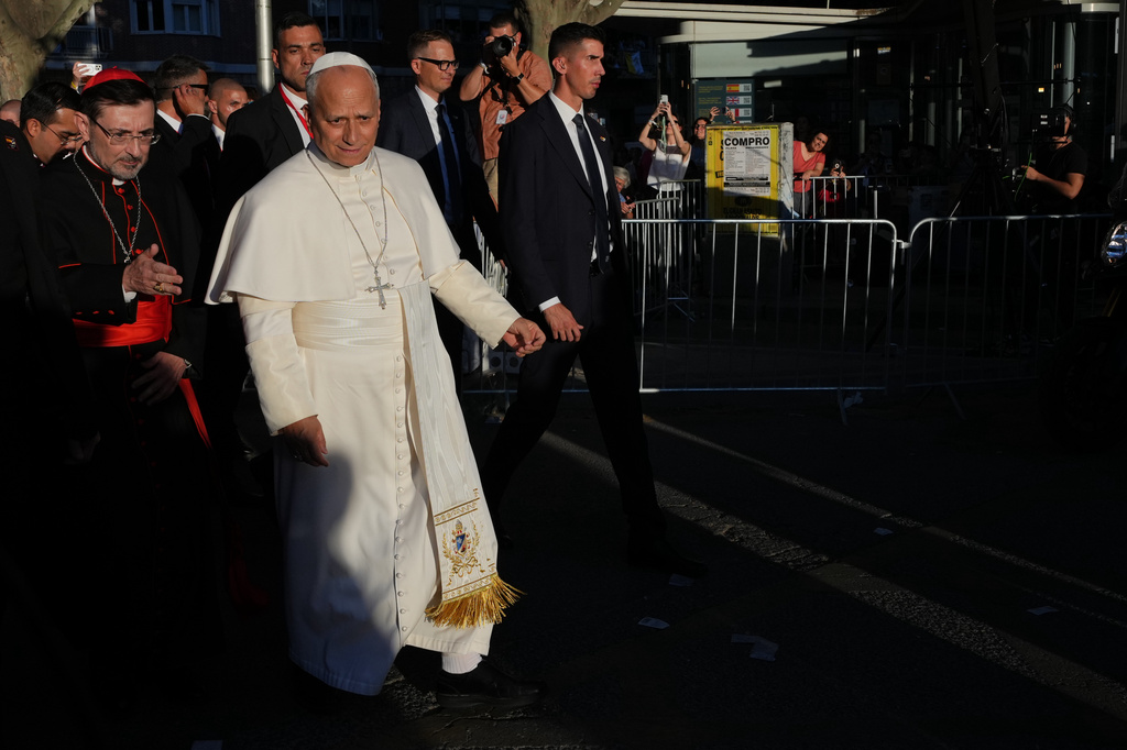 Pope Leo XIV, accompanied by the Archbishop of Madrid Cardinal José Cobo Cano, left,, arrives at Plaza de Lima in Madrid, Saturday, June 6, 2026, for a prayer vigil with young people on the first day of a seven-day apostolic journey to mainland Spain and the Canary Islands. (AP Photo/Alessandra Tarantino)