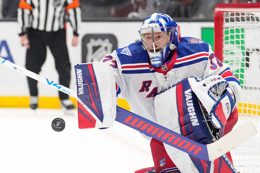 New York Rangers goaltender Jonathan Quick deflects a shot during the second period of an NHL hockey game against the Los Angeles Kings, Tuesday, Jan. 20, 2026, in Los Angeles. (AP Photo/Mark J. Terrill)