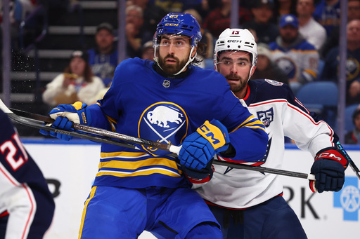 Buffalo Sabres right wing Alex Tuch (89) and Columbus Blue Jackets defenseman Dante Fabbro (15) battle for position during the first period of an NHL hockey game Tuesday, Oct. 28, 2025, in Buffalo, N.Y. (AP Photo/Jeffrey T. Barnes) Buffalo Sabres right wing Alex Tuch (89) and Columbus Blue Jackets defenseman Dante Fabbro (15) battle for position during the first period of an NHL hockey game Tuesday, Oct. 28, 2025, in Buffalo, N.Y. (AP Photo/Jeffrey T. Barnes)