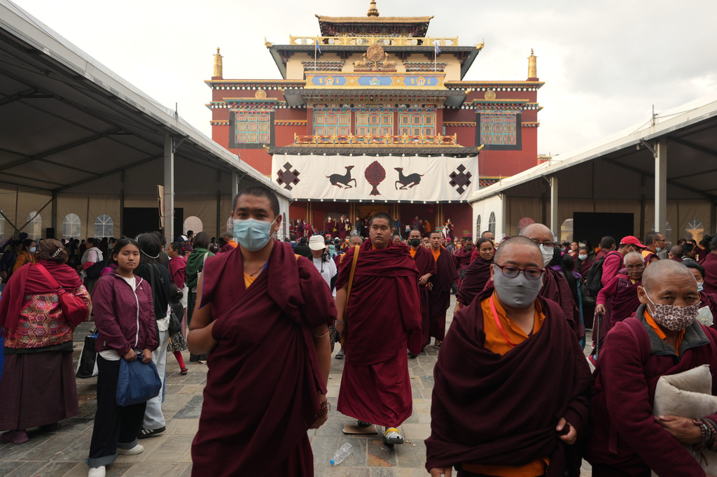 U.S.-born Buddhist lama Jalue Dorje walks out of Shechen Monastery after a day of rituals and teachings in Kathmandu, Nepal, on Thursday, April 9, 2026. (AP Photo/Luis Andres Henao)