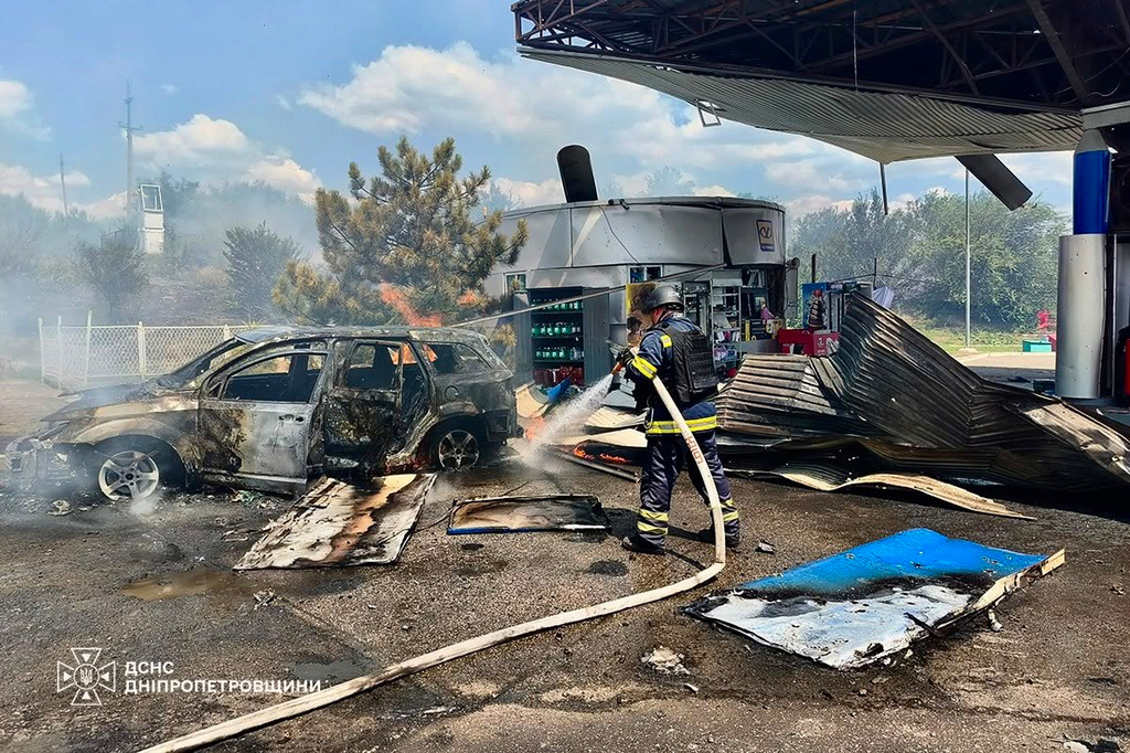 In this photo provided by the Ukrainian Emergency Service, firefighters put out a fire at a gas station following a Russian drone attack in Dnipropetrovsk region, Ukraine, Monday, Aug. 3, 2026. (Ukrainian Emergency Service via AP)