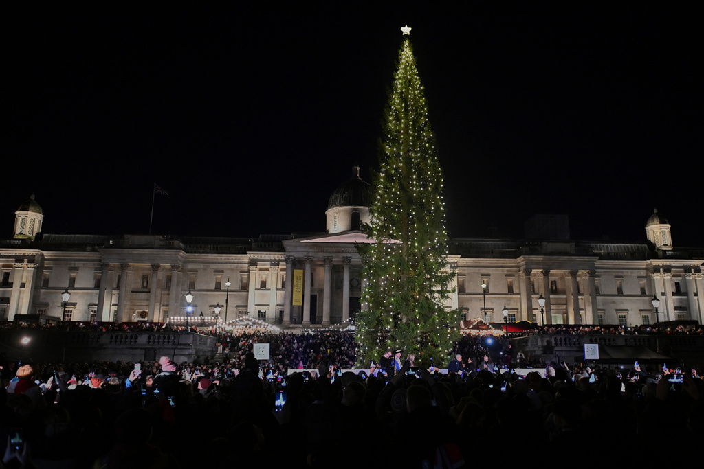 The traditional lighting up ceremony starts for the annual Norwegian gifted Christmas tree in Trafalgar Square, in London, England, Thursday, Dec. 4, 2025. (AP Photo/Thomas Krych)