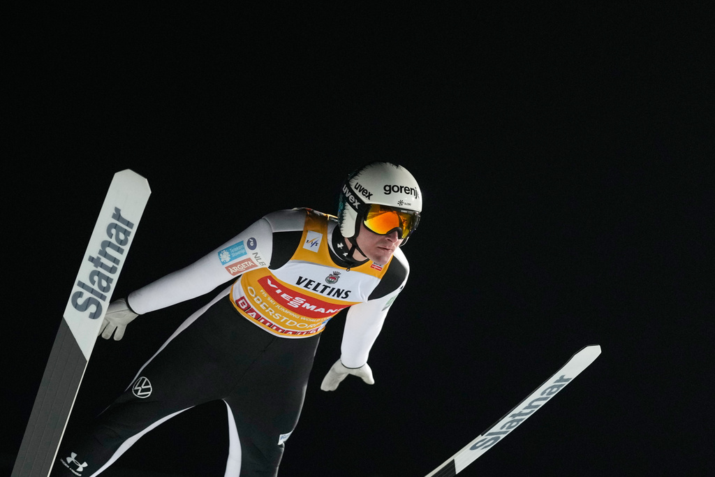 FILE - Domen Prevc, of Slovenia, soars through the air during his qualification jump at the first stage of the Four Hills ski jumping tournament in Oberstdorf, Germany, Dec. 28, 2025. (AP Photo/Matthias Schrader, File)
