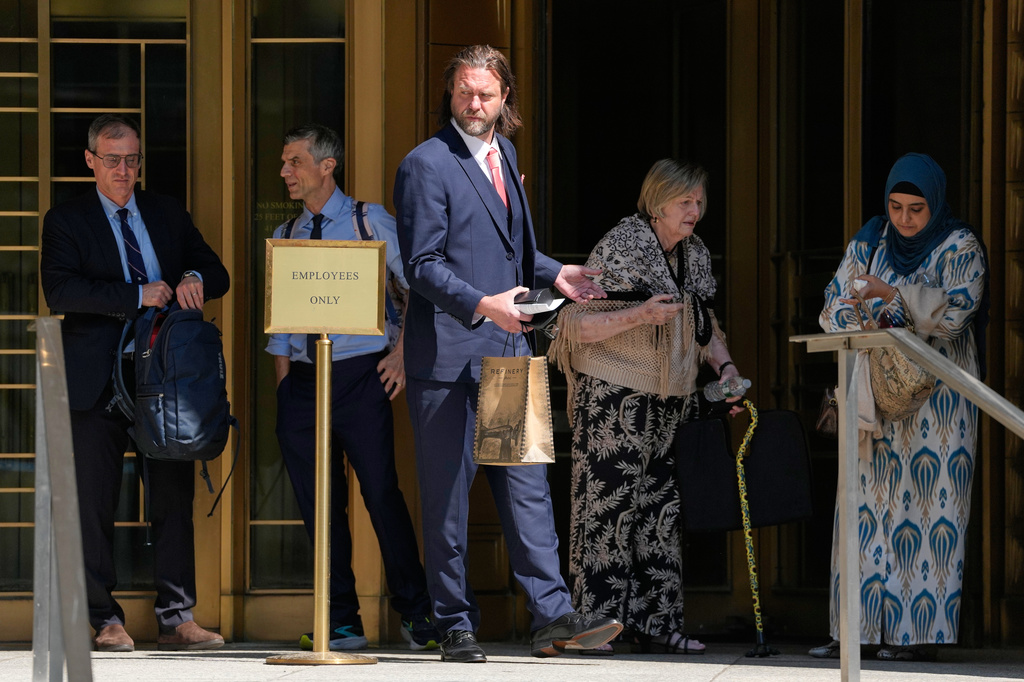 Carl Rinsch, center, leaves a federal courthouse in New York, Monday, June 29, 2026. (AP Photo/Seth Wenig)