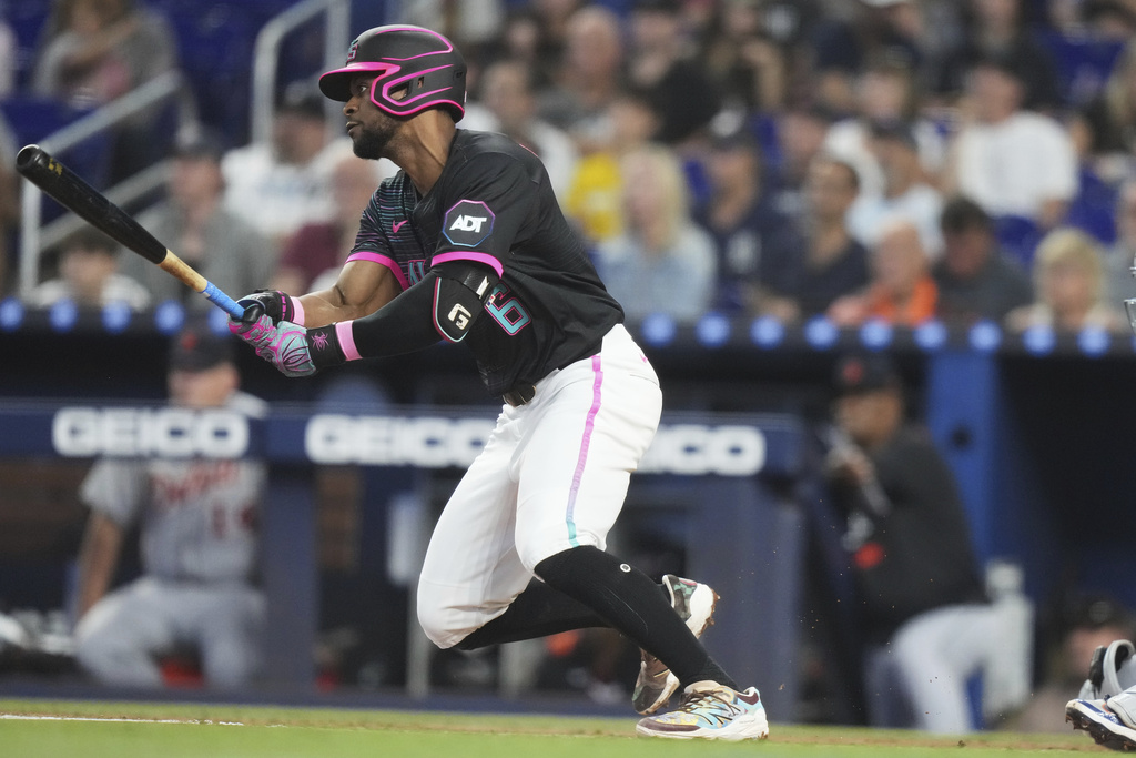 Miami Marlins' Otto Lopez (6) follows through on a RBI single to score Agustin Ramirez during the first inning of a baseball game against the Detroit Tigers, Saturday, Sept. 13, 2025, in Miami. (AP Photo/Lynne Sladky)