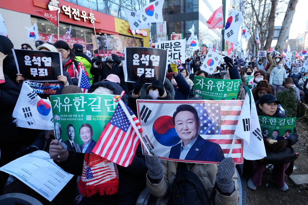 Supporters of former South Korean President Yoon Suk Yeol stage a rally outside of Seoul Central District Court in Seoul, South Korea, Thursday, Feb. 19, 2026. (AP Photo/Ahn Young-joon)