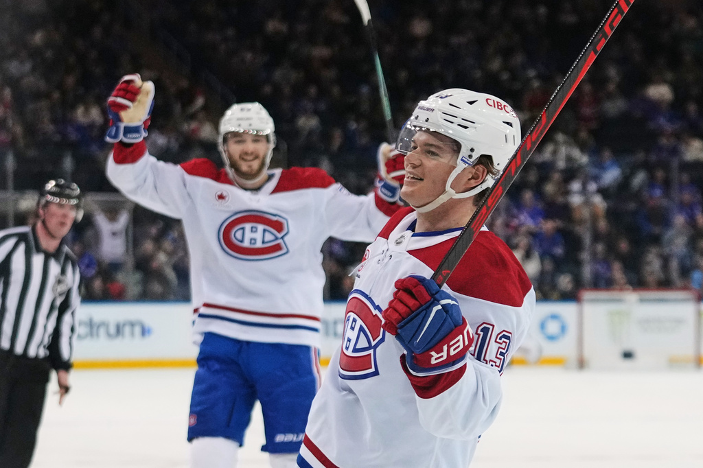 Montréal Canadiens' Cole Caufield (13) celebrates after scoring a goal during the third period of an NHL hockey game against the New York Rangers Thursday, April 2, 2026, in New York. (AP Photo/Frank Franklin II)
