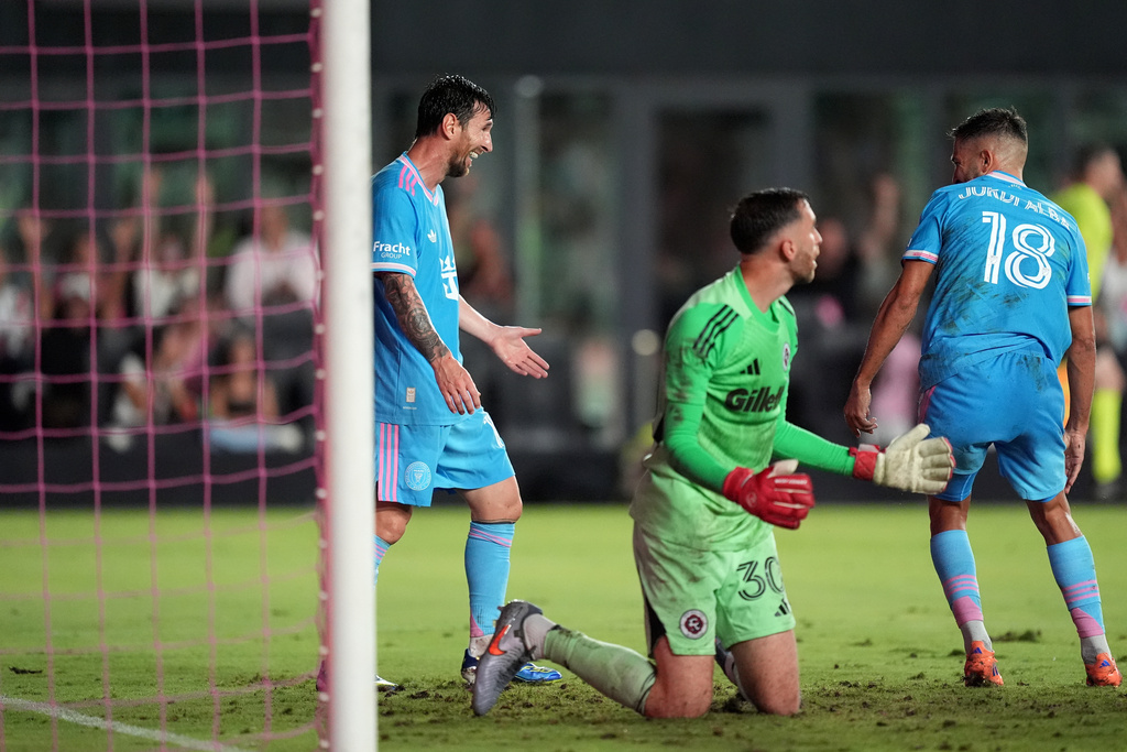 Inter Miami forward Lionel Messi, center left, reacts after teammate defender Jordi Alba (18) scores the side's second goal past New England Revolution goalkeeper Matt Turner (30), during the first half of an MLS soccer match, Saturday, Oct. 4, 2025, in Fort Lauderdale, Fla. (AP Photo/Rebecca Blackwell)
