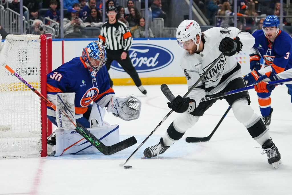 New York Islanders goaltender Ilya Sorokin (30) protects the net from Los Angeles Kings' Alex Laferriere (14) during the first period of an NHL hockey game Friday, March 13, 2026, at UBS Arena in Elmont, N.Y. (AP Photo/Frank Franklin II)
