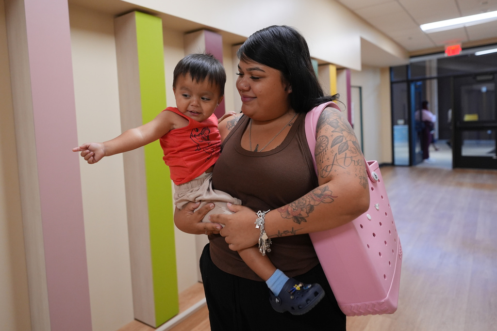 Sandra Mosqueda and her 2-year-old son make a visit to Pre-K 4 SA, Oct. 9, 2025, in San Antonio. (AP Photo/Eric Gay)