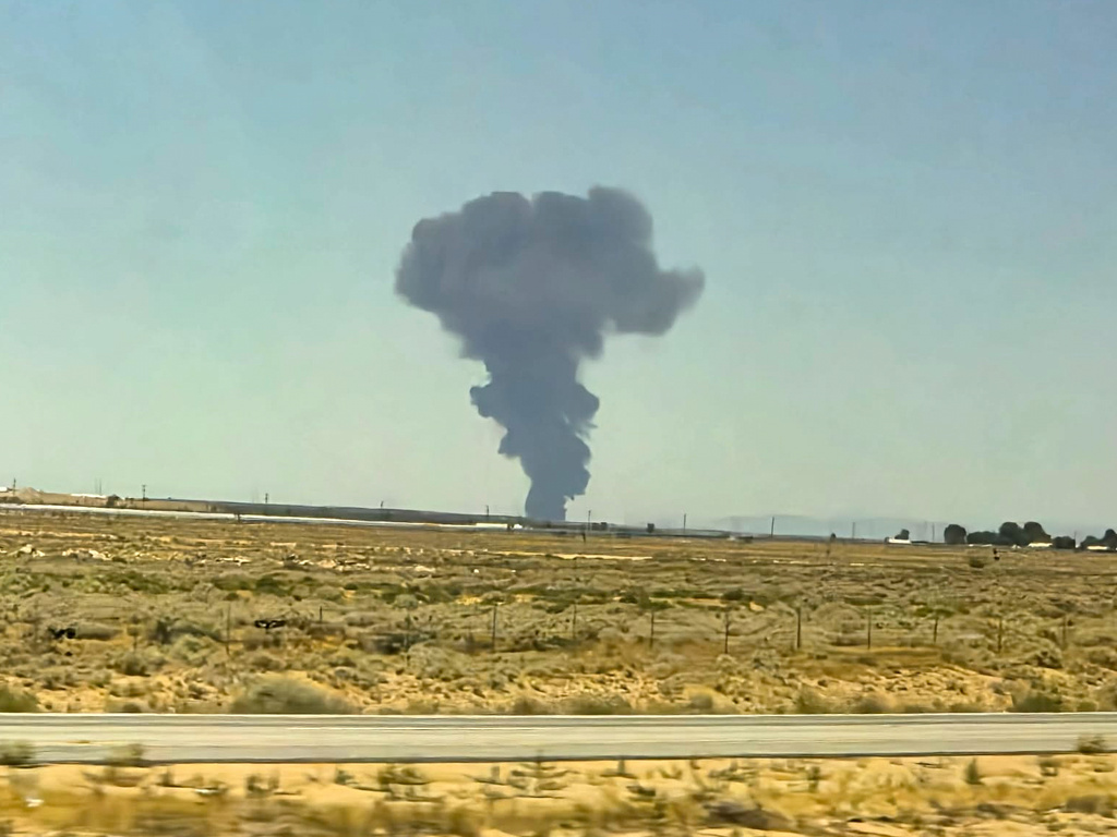 Smoke plumes rise from a B-52 bomber that crashed shortly after takeoff at a U.S. Air Force base in Southern California, Monday, June 15, 2026. (Debbie Reyes Katz via AP Photo)